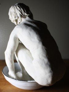 boy bathing - back view - lit from side